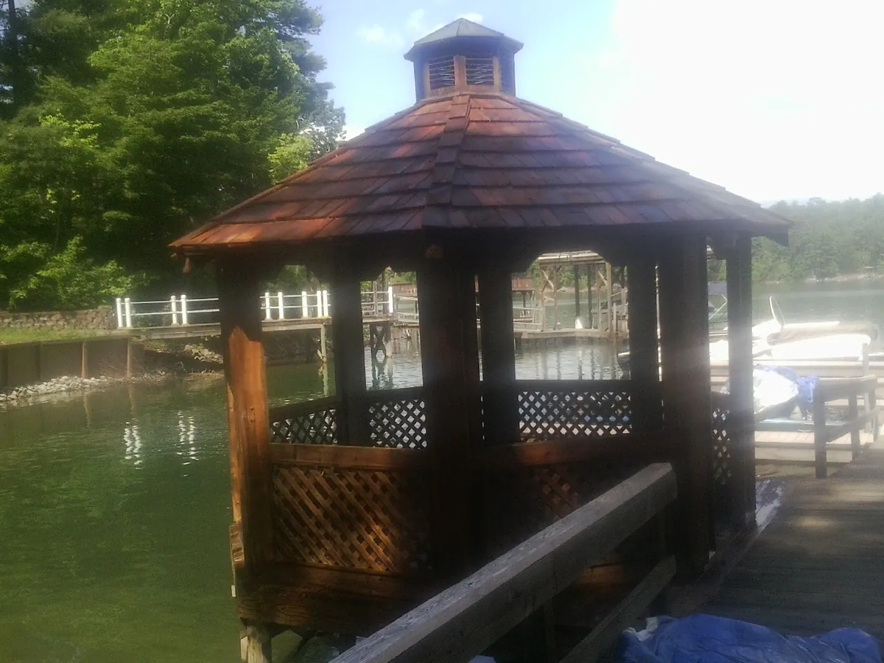 Cedar shake gazebo roof rebuilt on a lake dock in Rocky Hill